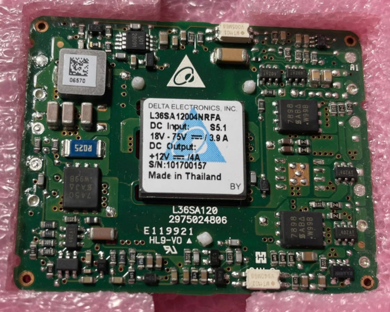 Green PCB DC-DC converter module with Delta Electronics label and input/output specs