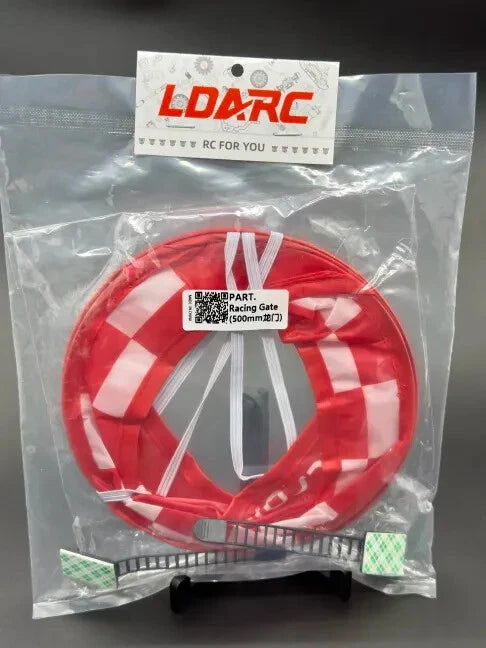 Red RC drone racing gate ring with checkered pattern, packaged in clear plastic bag
