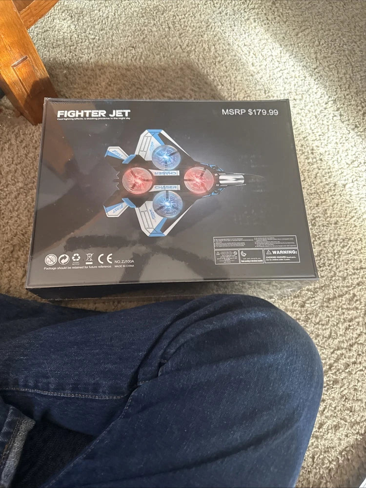 Fighter jet drone retail box with blue and red jet graphic and MSRP label