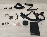 GoPro waterproof action camera bundle with chest harness, mounts, case, and handle