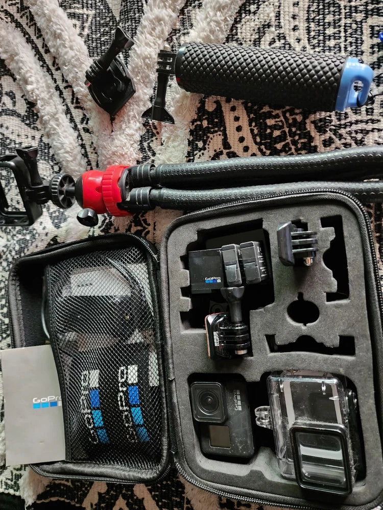 GoPro HERO7 action camera kit with mounts and waterproof housing in zip case