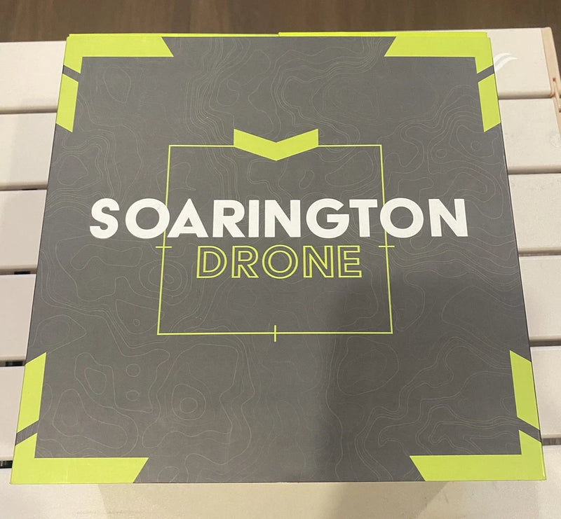 Soarington Drone retail box with logo in white and neon green