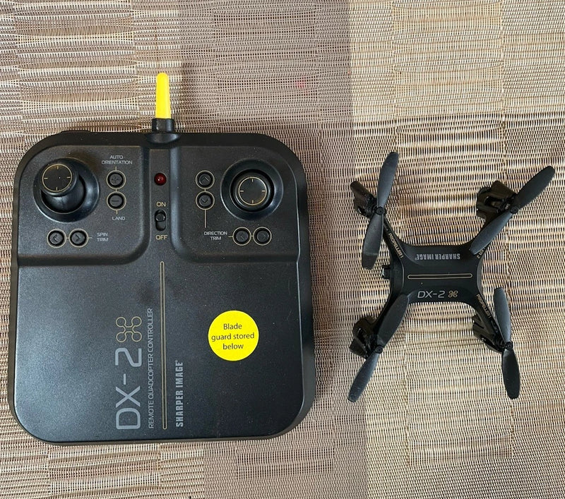 Sharper Image DX-2 rechargeable remote quadcopter with handheld controller and four rotors