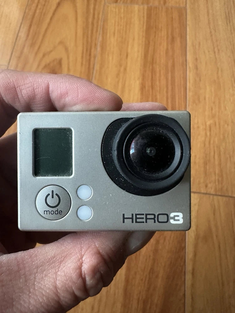 GoPro HERO3 Silver action camera front with lens, LCD screen, and mode buttons