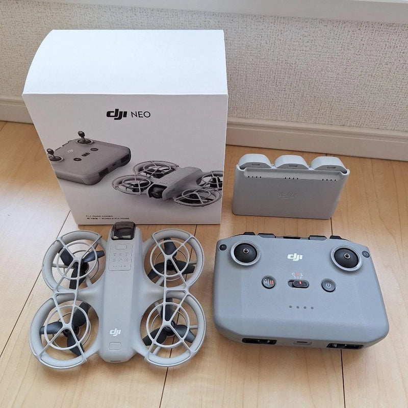 DJI Neo drone with controller and propellers, in carrying case