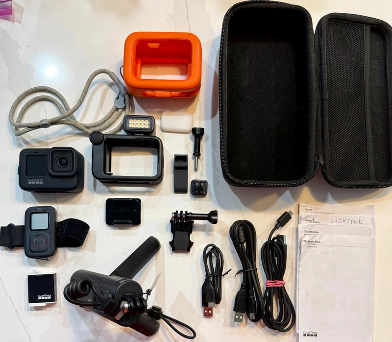 GoPro HERO12 Creator Edition accessory kit with camera, protective case, mounts, cables