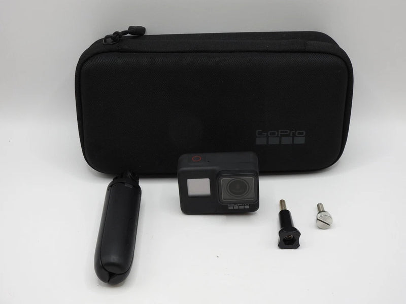 GoPro HERO7 Black action camera kit with carrying case, handle, mounts, and screw