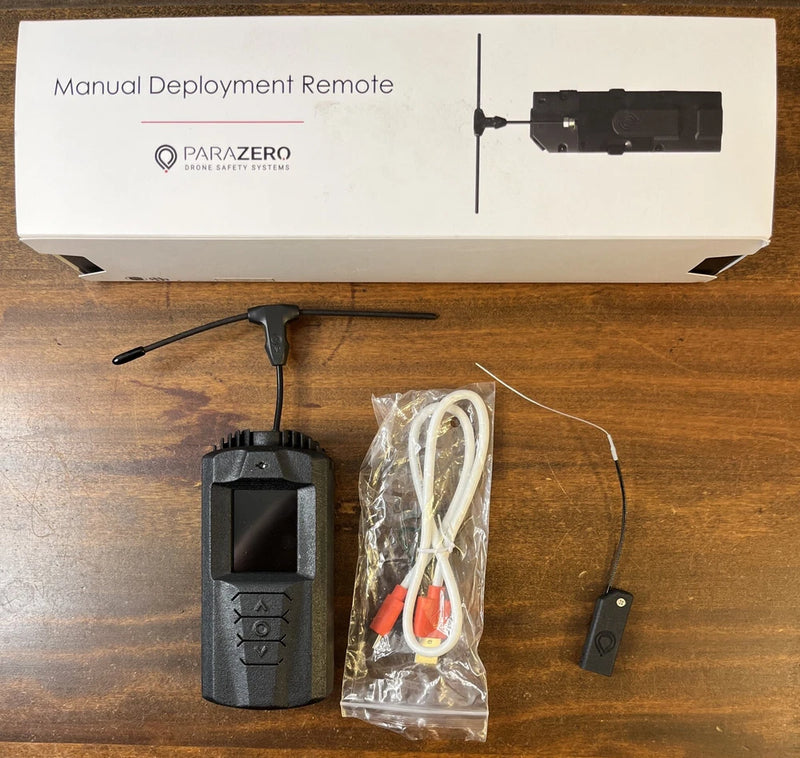 ParaZero manual deployment remote control, black device with antenna rod and cable set