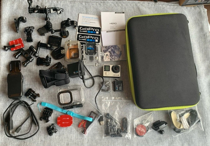 GoPro Hero4 action camera bundle with camera, waterproof case, mounts, and accessories
