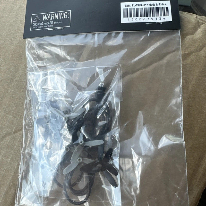 Black micro drone propeller blade set in sealed plastic bag