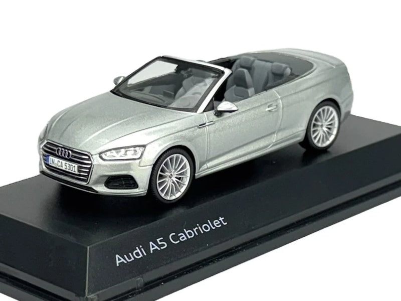 Silver Audi A5 Cabriolet die-cast model car, front 3/4 view on base