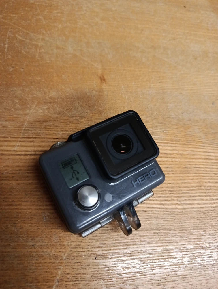 GoPro HERO action camera housing with front lens and LCD screen, black