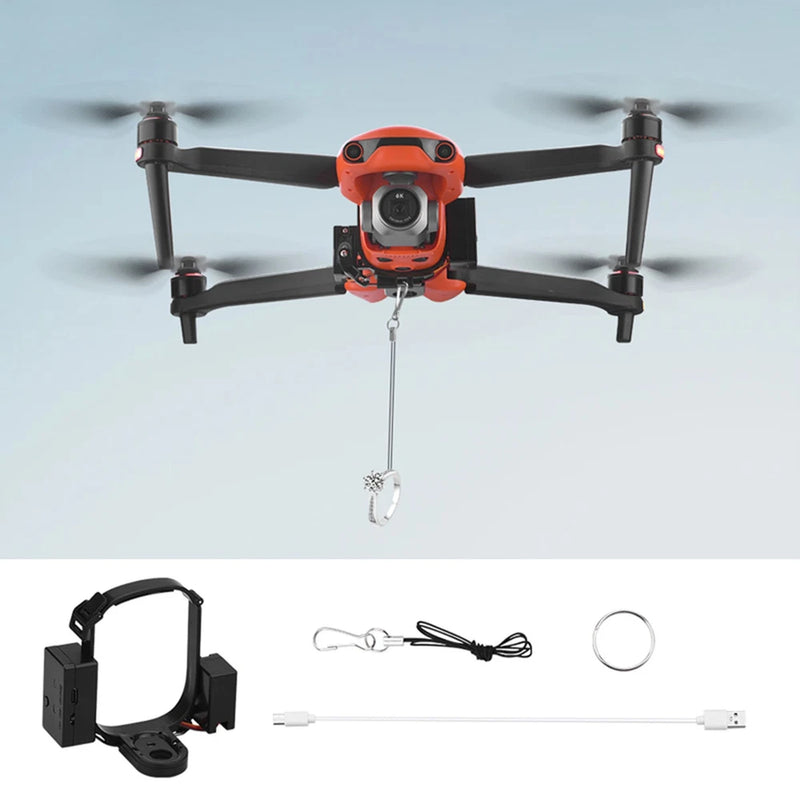 RC drone airdrop launcher with orange unit and hanging metal release hook