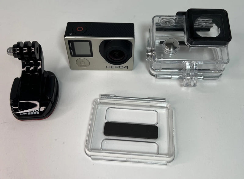GoPro HERO4 action camera kit with silver camera, clear waterproof case, and mount