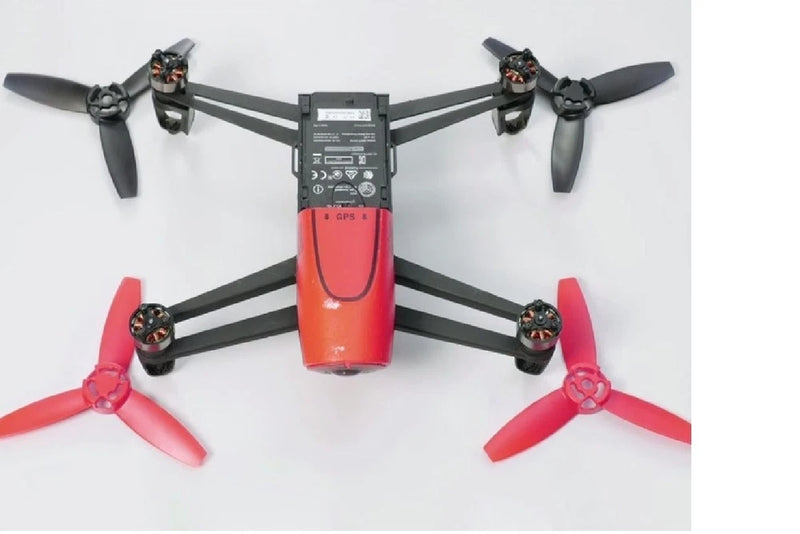 Orange quadcopter drone with six black motor arms and four propellers