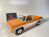 Maisto 1/18 Scale - 1974 Chevrolet C10 Cheyenne Super  - Orange Diecast Model.