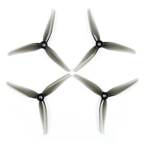 Set of four FPV drone propellers with black motor hubs, 3-blade each