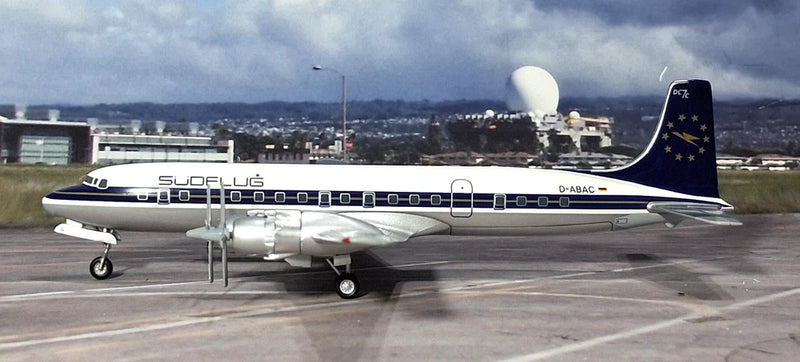 Douglas DC-7C model airplane, white fuselage with dark blue tail and star markings