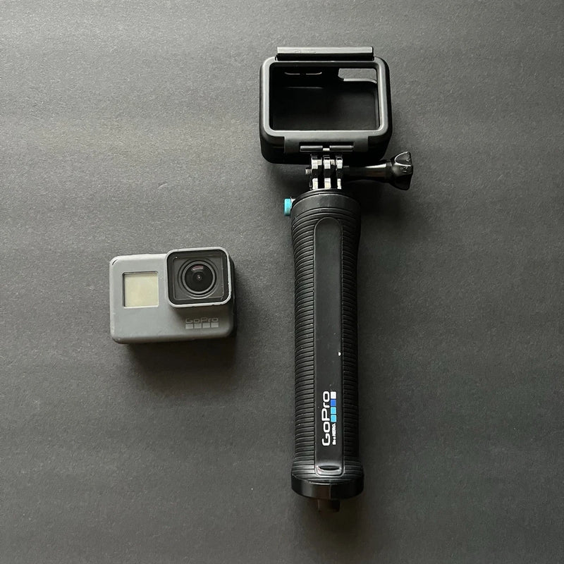 GoPro action camera grip handle with mounting cradle and thumb screw, black