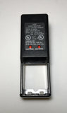 Sakar battery charger with open AA/AAA slot and specification label