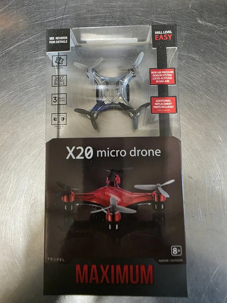 Propel micro drone quadrocopter in retail box, gray body with red propellers