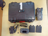 Gray hard case with foldable drone, remote controller, batteries, and cables
