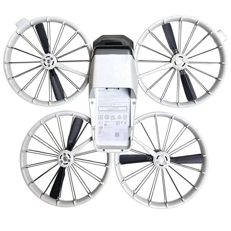Drone with four white propellers and central body, battery and controller not included.