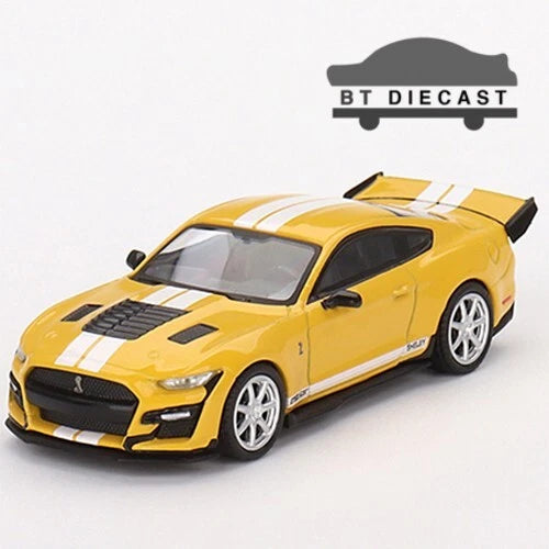 Yellow die-cast model car with white racing stripes and black front grille