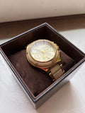Gold chronograph wristwatch with round dial and gold-tone link bracelet