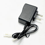Black battery charger with US two-prong plug and cable with white round connector