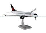 Air Canada Airbus A220-300 model airplane on gray display stand, front view