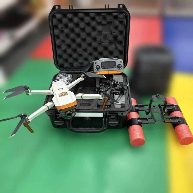 Drone set with camera and propellers in open hard case, green and red arms