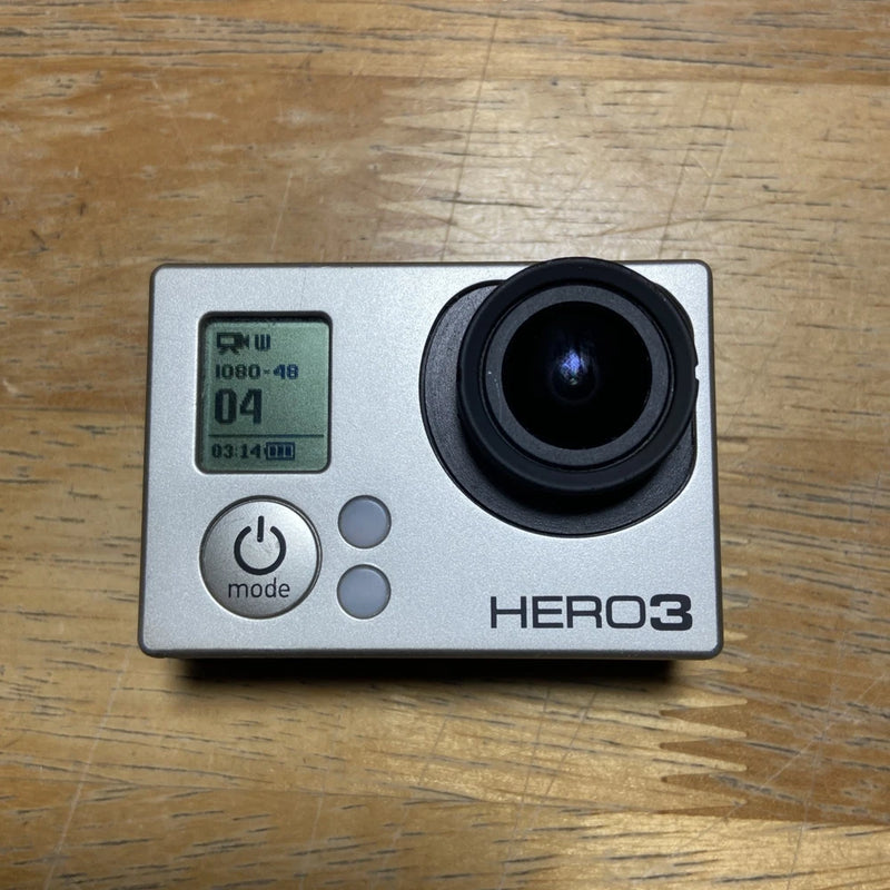 GoPro HERO3 video camcorder with LCD screen, mode button, and black lens, silver body