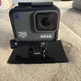 GoPro HERO7 Black action camera with front lens and mounting bracket