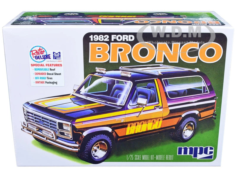 MPC 1982 Ford Bronco 1/25 scale model car kit box, orange and blue pickup truck artwork