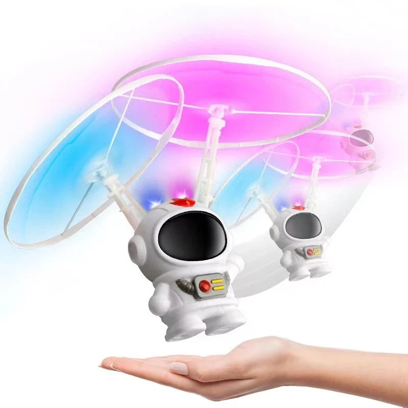 Kids LED flying drone toy shaped like a white astronaut with black helmet screen