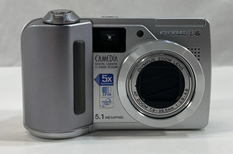Silver Olympus CAMEDIA C-5500 digital camera with zoom lens, 5.1 MP, front view.