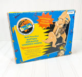 Battery-operated wooden Tyrannosaurus model kit box with moving dinosaur parts