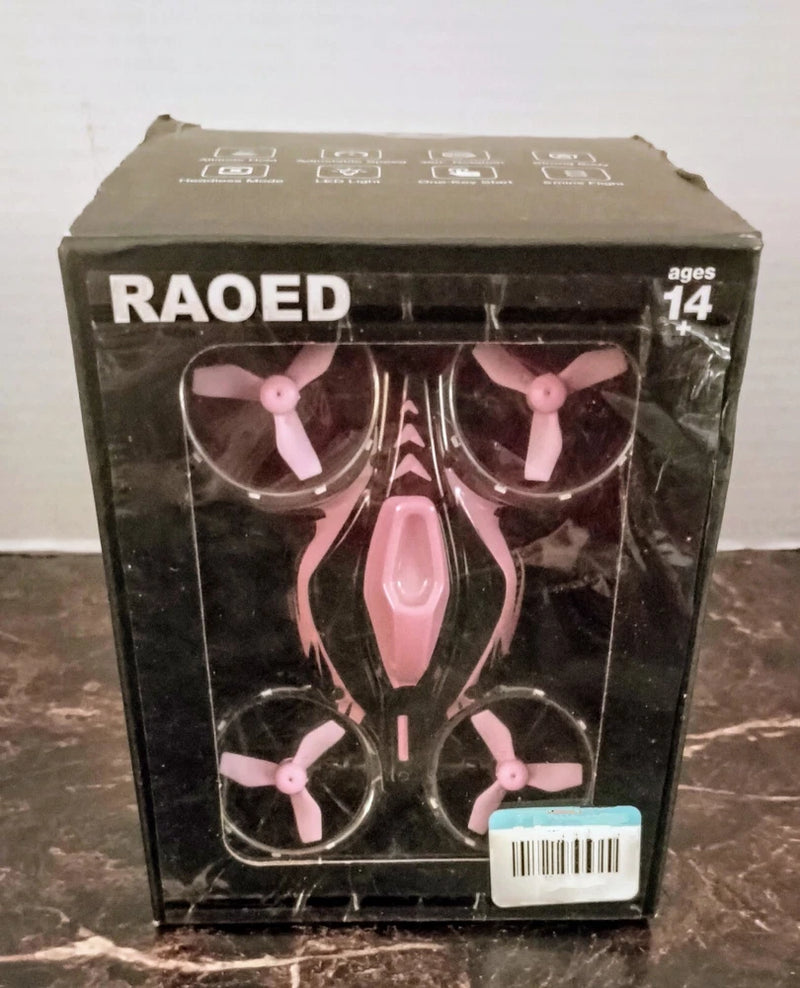 RAOED EC210 quadcopter drone in pink with four propellers, boxed
