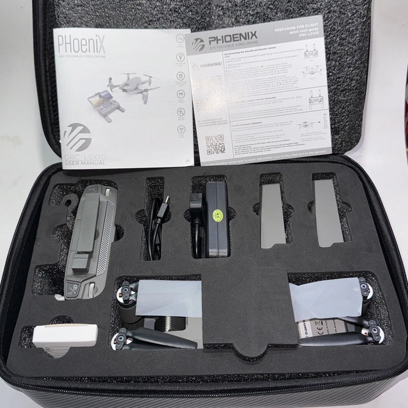 Foldable drone GPS kit in hard case with drone, battery, and manuals