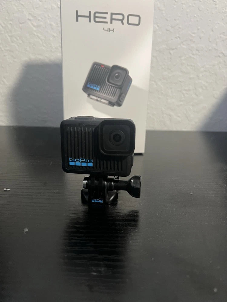 GoPro action camera with black waterproof housing and touch screen, front view