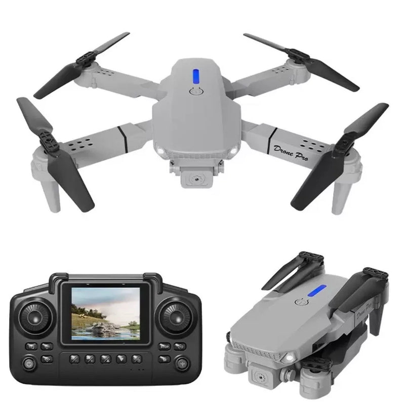 Gray foldable quadcopter with four propellers and handheld screen controller