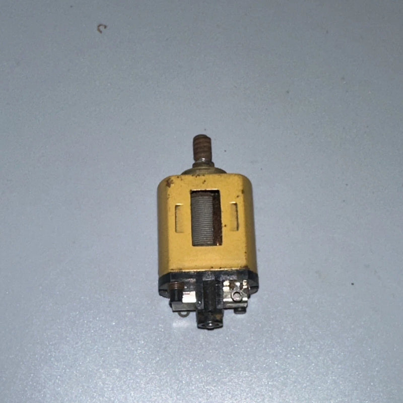 Yellow DC hobby motor with top shaft and black mounting bracket