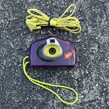 Purple vintage digital camera with yellow cord and orange slime logo