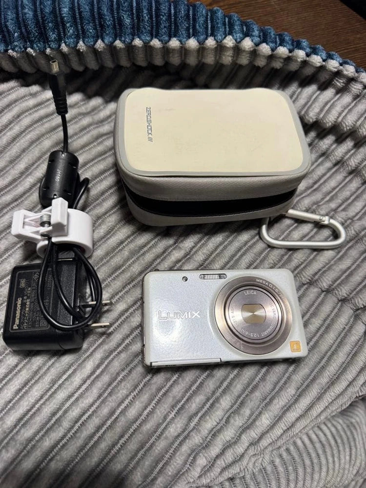 Silver Panasonic LUMIX FX80 compact digital camera with lens, plus charger and carrying case