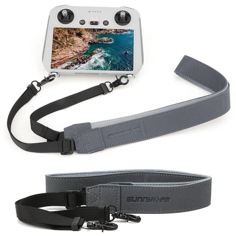 Grey drone remote control transmitter strap with adjustable black webbing and clips