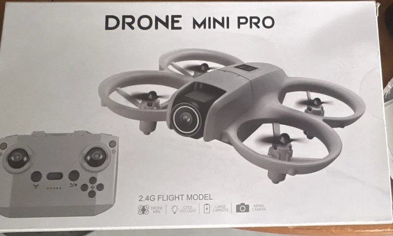 Foldable gray mini drone with front camera and propellers, plus gray remote controller.