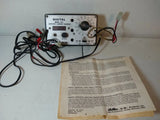 Digital RC battery charger with dials, ports, cables, and instruction manual