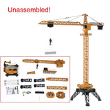HUINA RC tower crane model with multiple unassembled parts and base stand