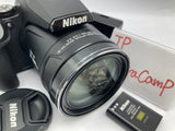 Black Nikon COOLPIX digital camera with zoom lens and textured grip